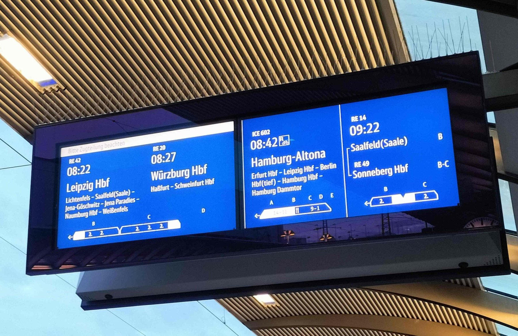 Departure board at a German railway station showing trains to Leipzig, Hamburg and Würzburg